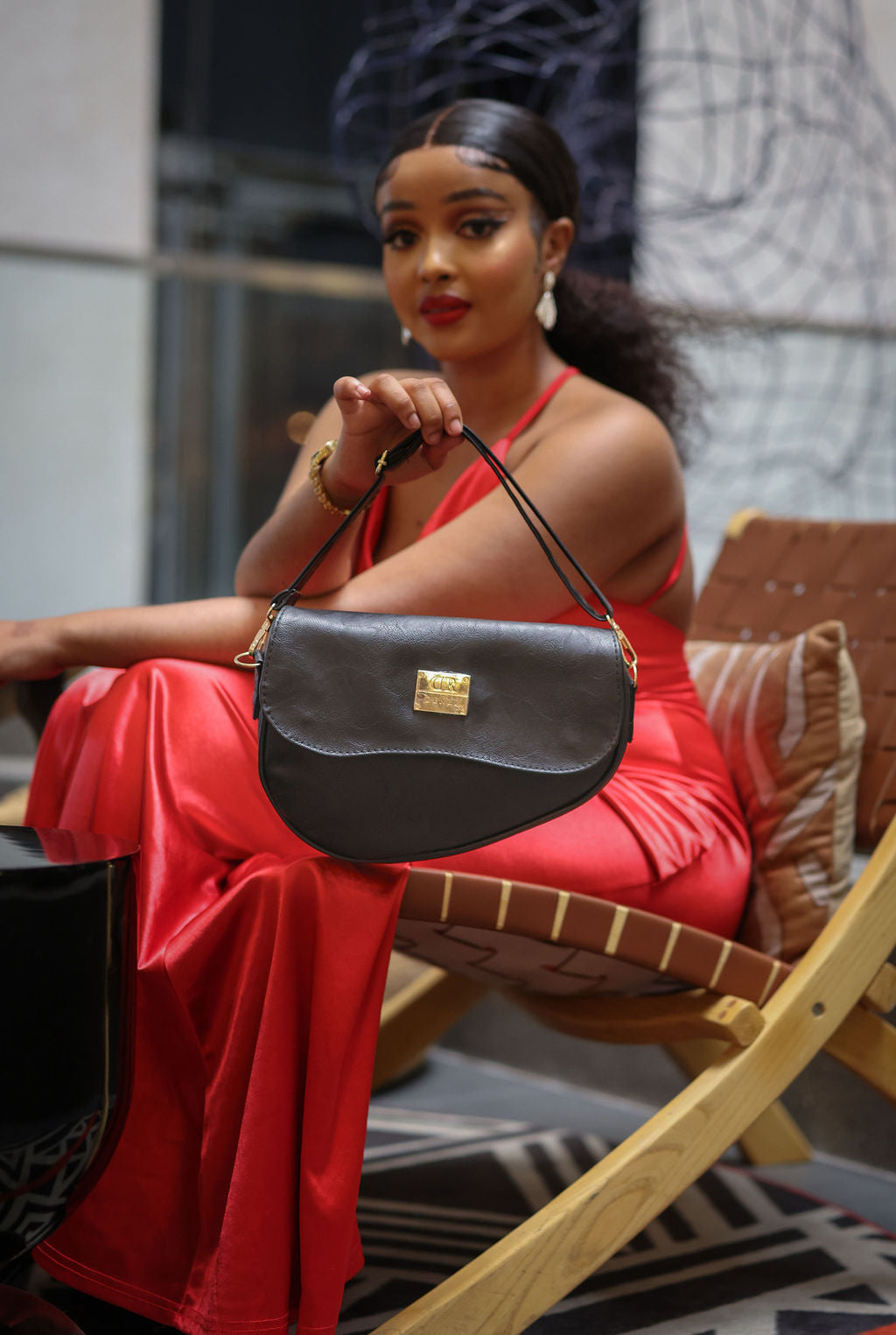 Denri Africa's black Montana Sling Bag. Ultra-minimal black sling, compact silhouette, functional everyday bag.