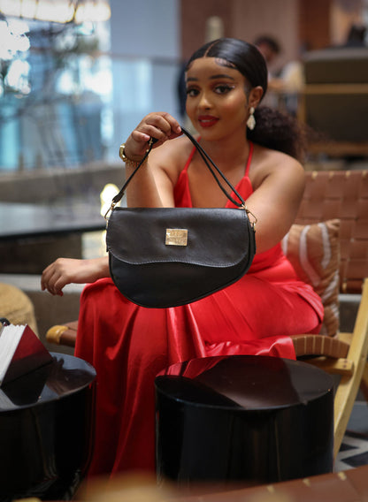 Denri Africa's black Montana Sling Bag. Professional black sling purse, lightweight and portable.