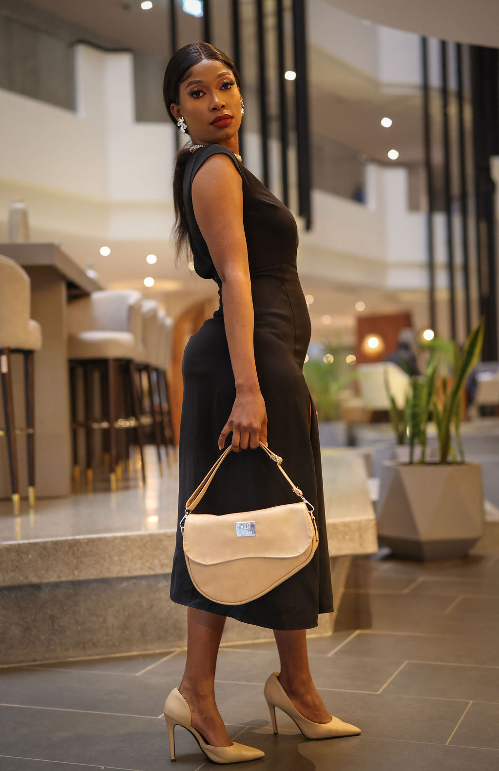 Denri Africa's beige Montana Sling Bag. Stylish neutral crossbody sling, durable build, modern look.