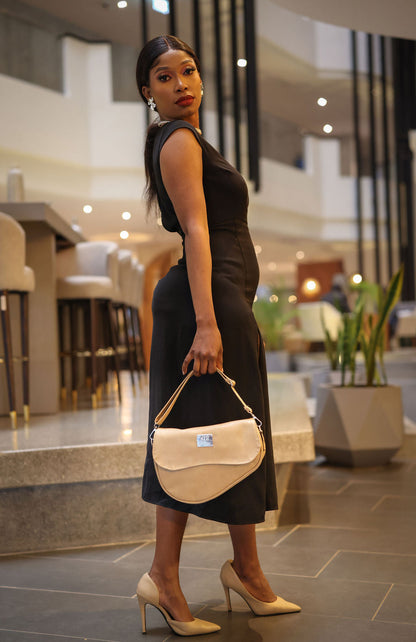 Denri Africa's beige Montana Sling Bag. Stylish neutral crossbody sling, durable build, modern look.