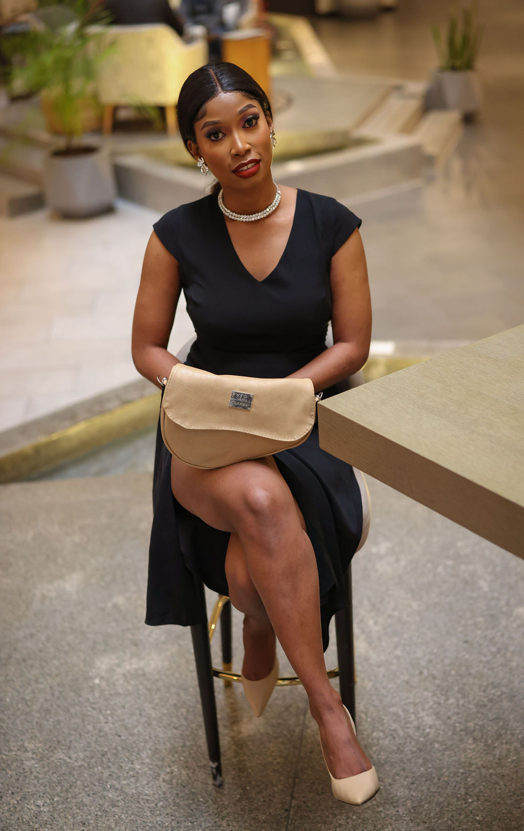 Denri Africa's beige Montana Sling Bag. Minimalist sling bag, warm beige tone, perfect for everyday routines.