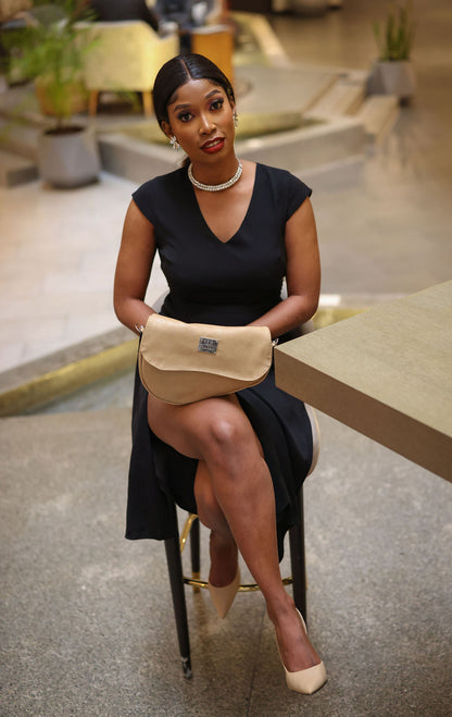 Denri Africa's beige Montana Sling Bag. Minimalist sling bag, warm beige tone, perfect for everyday routines.