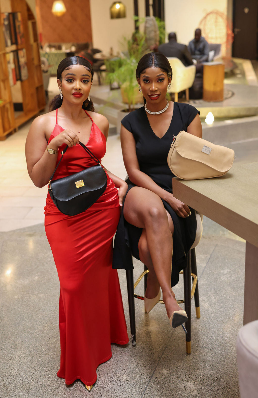 Denri Africa's black and beige Montana Sling Bags. Dual sling layout, modern vegan leather designs for daily wear.