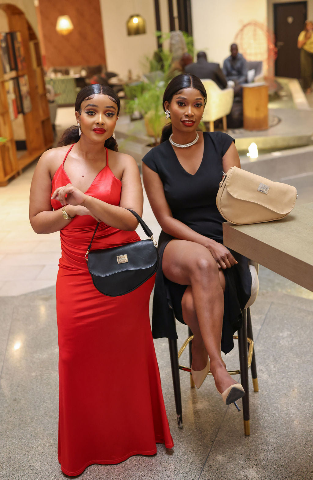 Denri Africa's black and beige Montana Sling Bags. Two-bag product display, contrasting sling colors, everyday carry bags.