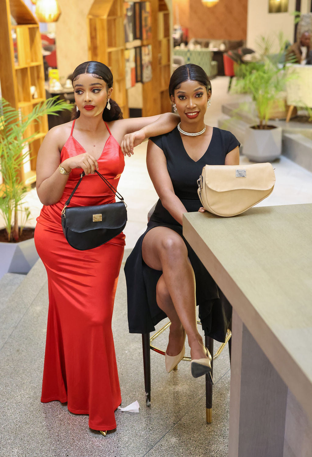 Denri Africa's black and beige Montana Sling Bags. Elegant dual-color combination, compact sling bags for errands.