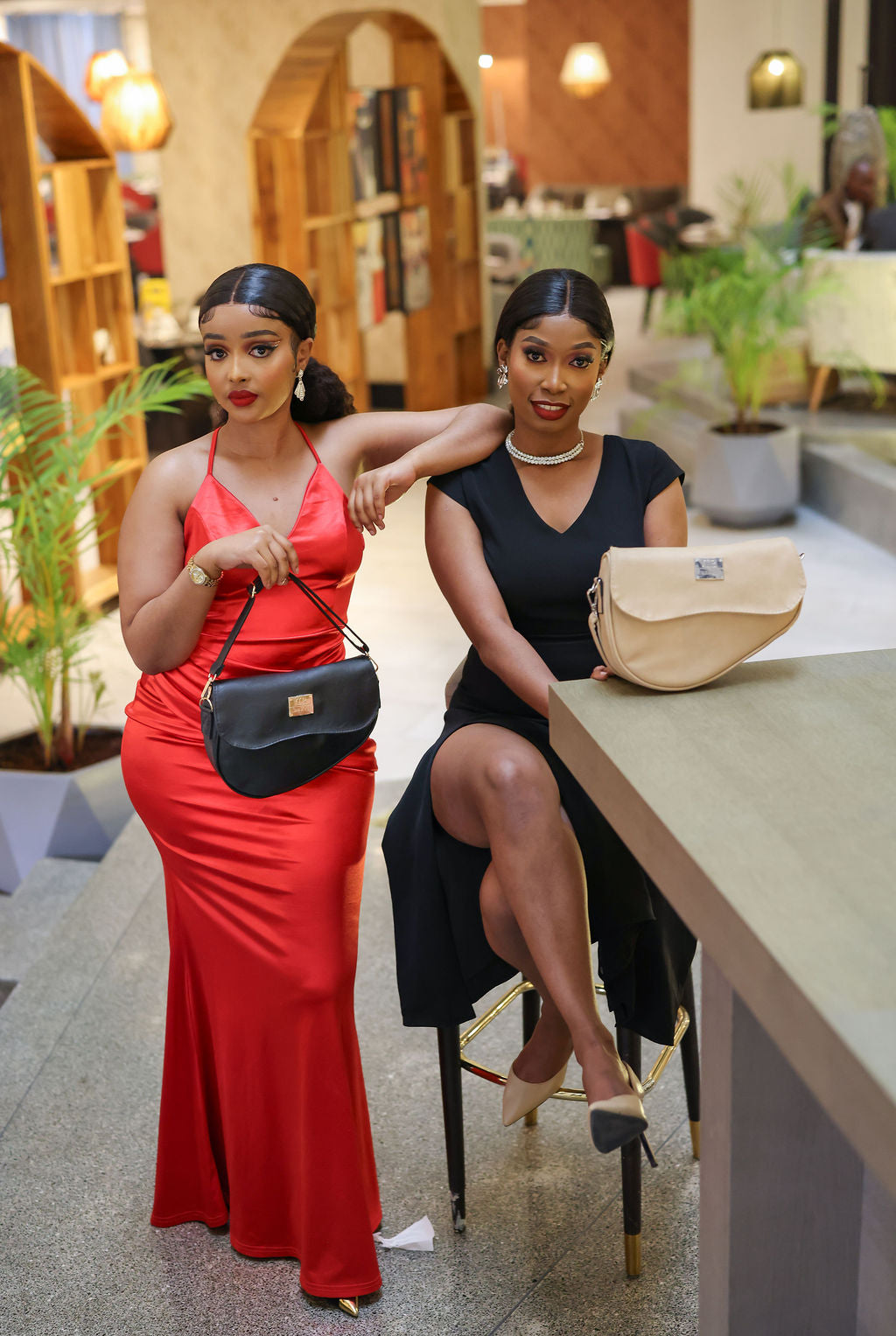 Denri Africa's black and beige Montana Sling Bags. Dual-tone display set, vegan leather slings for everyday use.