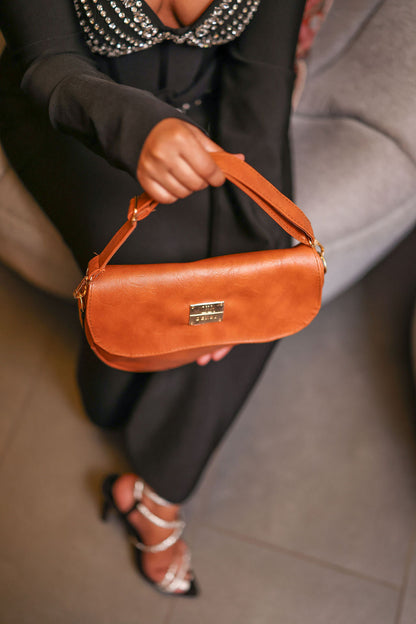 Denri Africa's spice Montana Sling Bag. Contemporary spice sling, minimalist look, perfect for casual days.