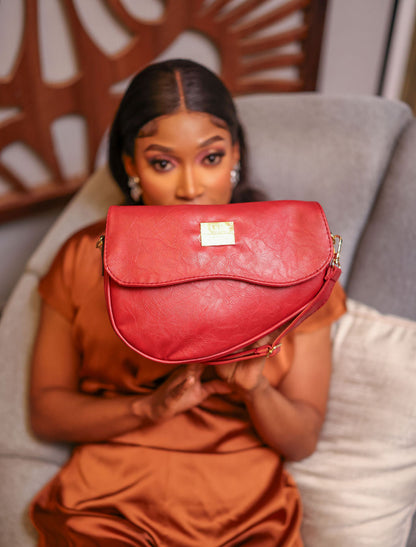 Denri Africa's red Montana Sling Bag. Trendy crossbody sling, bright red finish, compact everyday carry.