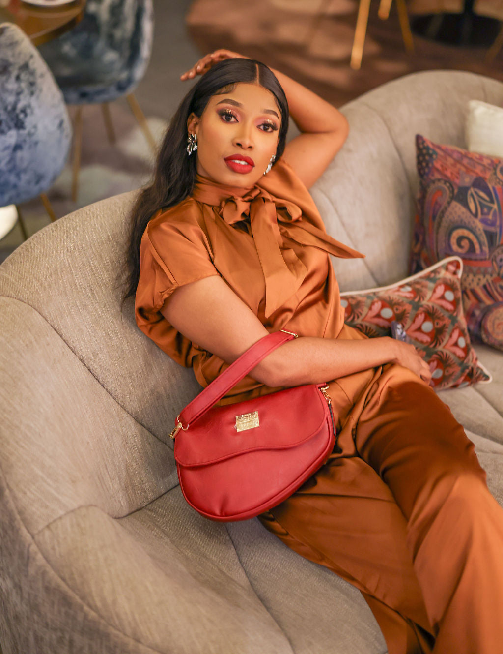 Denri Africa's red Montana Sling Bag. Functional red crossbody sling, minimalist design, travel and daily use.