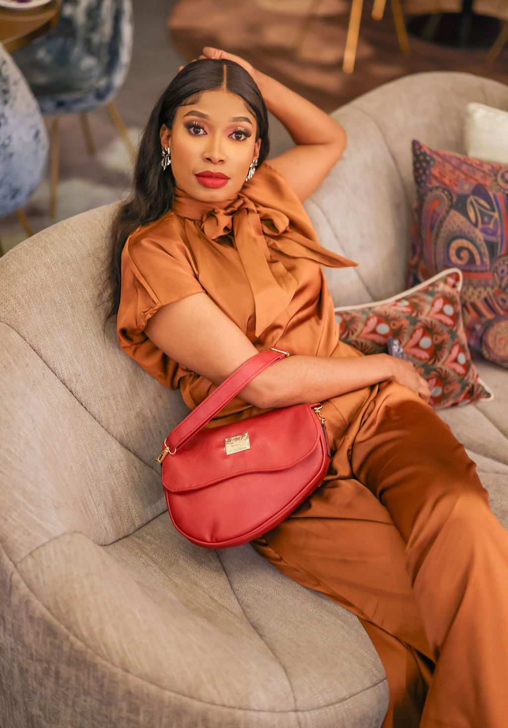 Denri Africa's red Montana Sling Bag. Stylish red sling purse, lightweight vegan leather carry bag, daily wear accessory.