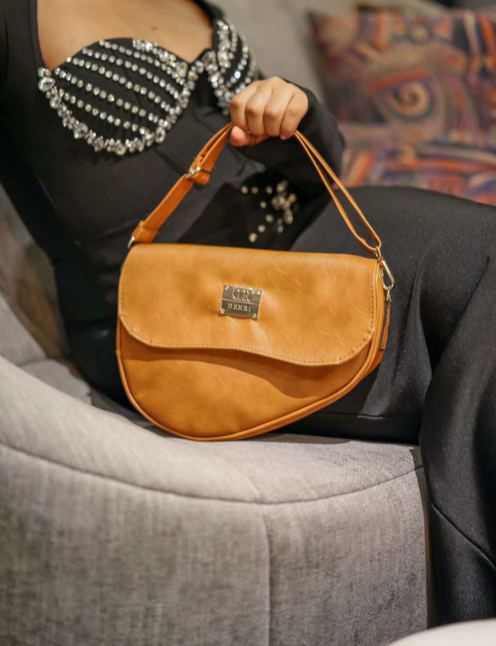 Denri Africa's beige Montana Sling Bag. Everyday beige crossbody, simple and modern, vegan leather style.