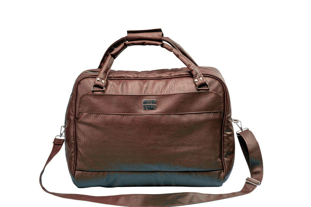 Denri Africa's brown Voyage Travel Bag. Extra-large travel bag, rugged vegan leather carryall, great for extended trips.